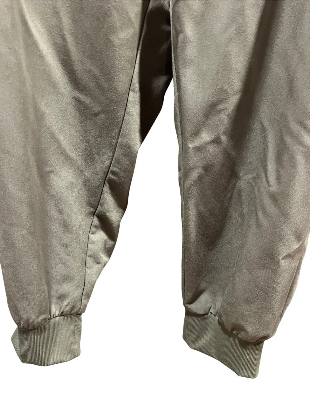 FIGS Casma three-pocket V-neck scrub top featuring a soft greyish-green.